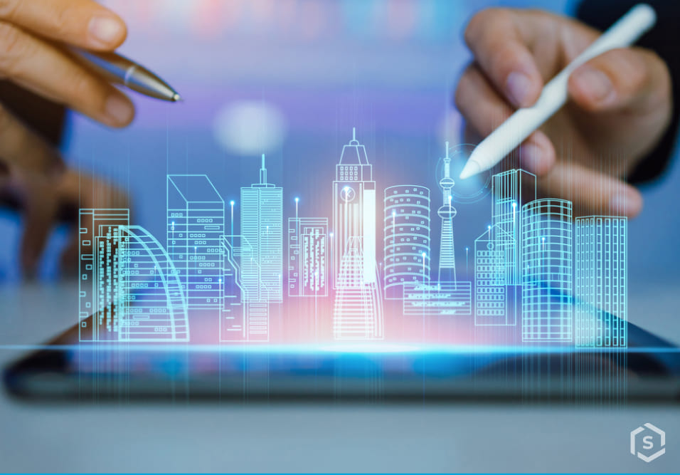 Duas pessoas interagindo com um tablet que exibe uma cidade futurista com prédios de desenho digital, simbolizando tecnologia e inovação Duas pessoas interagindo com um tablet que exibe uma cidade futurista com prédios de desenho digital, simbolizando tecnologia e inovação